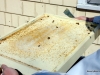 The bottom board had a layer of sugar, paper, dead bees and mites.