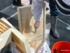 Here I am cleaning the bottom board with my hive tool.