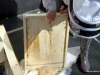 Here I am cleaning the bottom board with my hive tool.