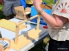 Jane Sloboda demonstrating a gadget to help install foundation.