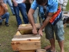 Inspecting a top bar hive.