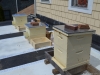 The empty hives are ready for package installation.