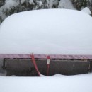 The overhanging roof of this top bar hive kept the entrances clear of snow despite the epic snowfall.