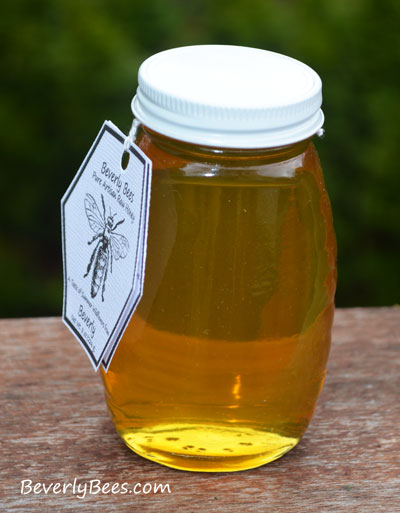 Honey in a 8 oz Queenline Jar